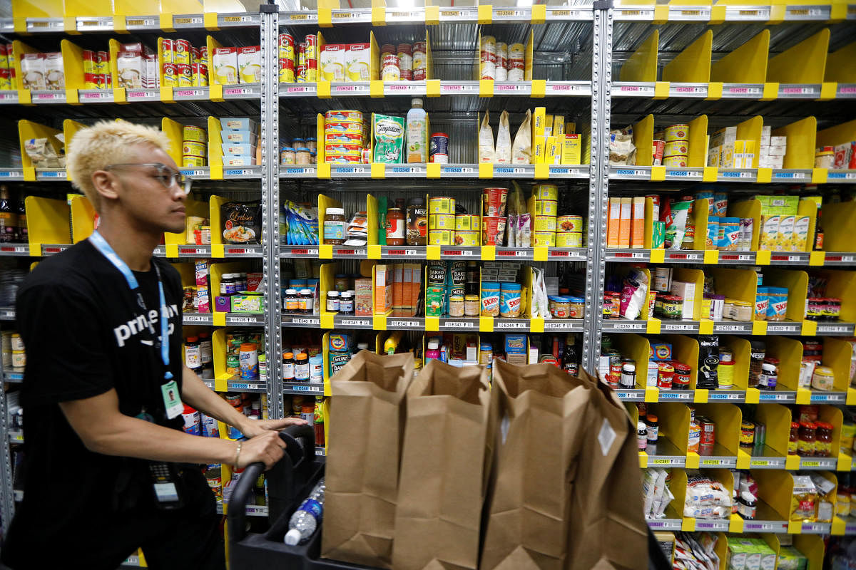 An employee works at Amazon's Prime Now fulfillment centre in Singapore July 27, 2017. REUTERS