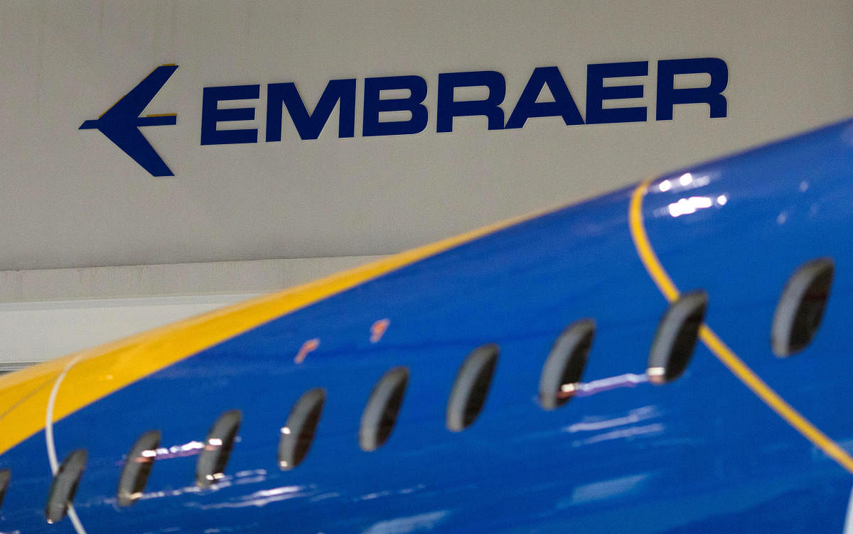 FILE PHOTO: The logo of Brazilian planemaker Embraer SA is seen at the company's headquarters in Sao Jose dos Campos, Brazil February 28, 2018. REUTERS/Roosevelt Cassio/File Photo