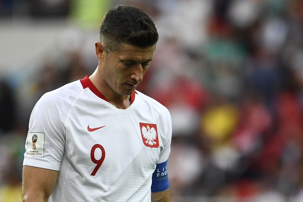 Poland's Robert Lewandowski looks dejected after his team went down 1-2 to Senegal in their Group H match on Tuesday. AFP