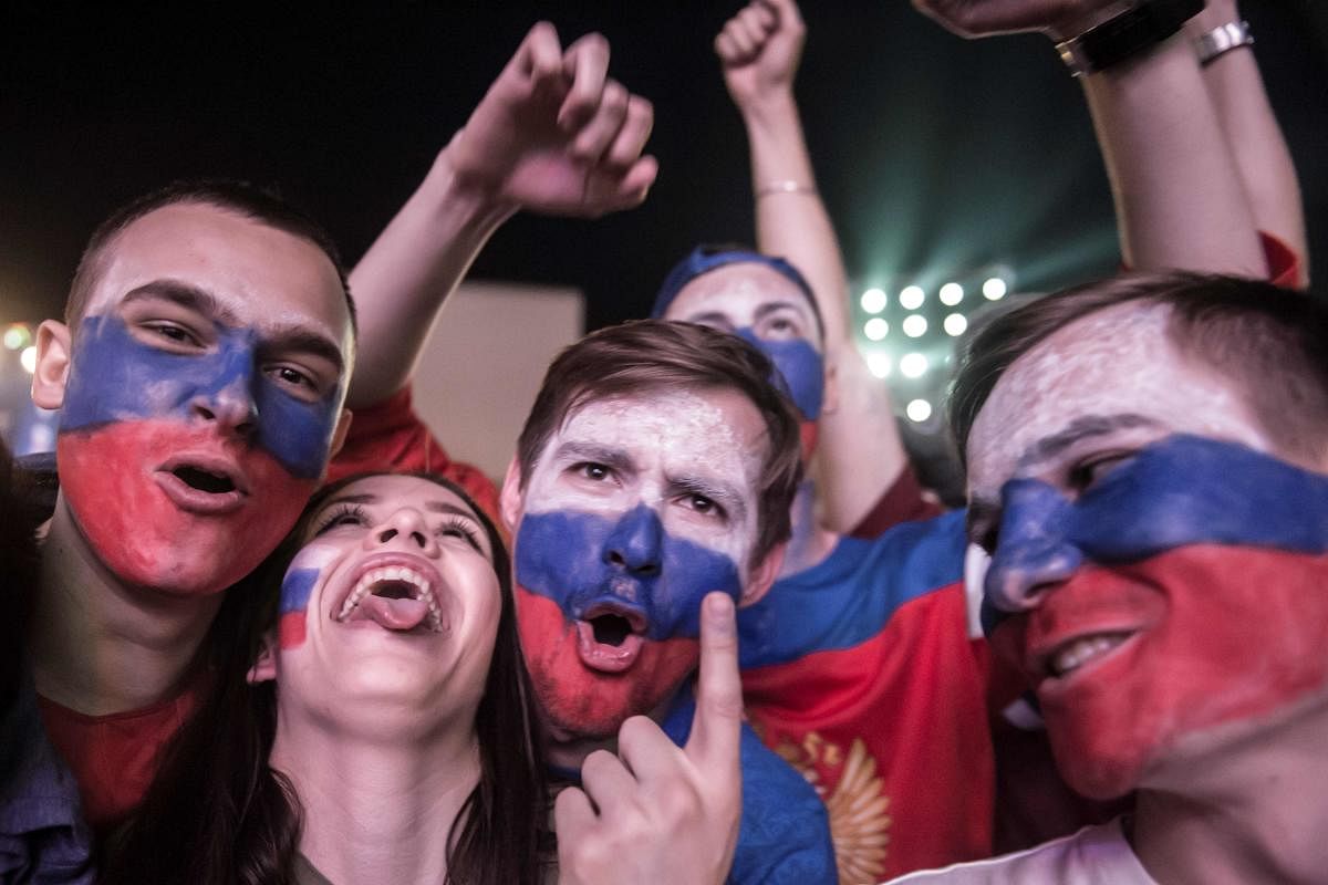 Russian football fans celebrate their team's victory against Egypt at the Fan Zone in Rostov-on-Don on June 19, 2018. AFP 