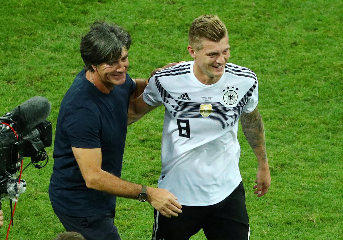 Germany coach Joachim Low and Toni Kroos celebrate after the match REUTERS.