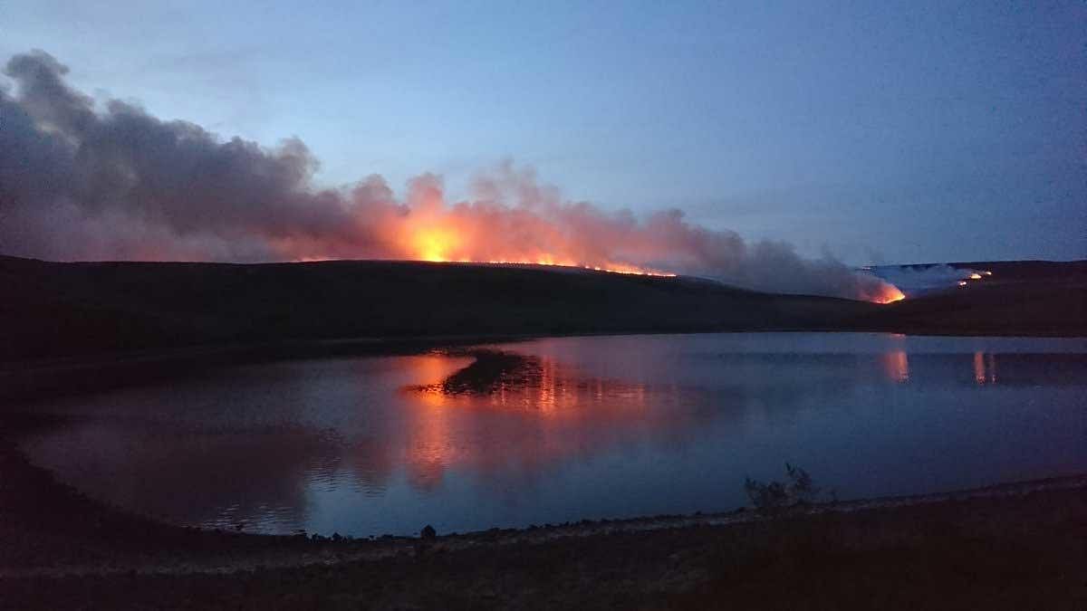 Firefighters battling a rare large wildfire in northern England, which has sparked the evacuation of dozens of homes, are being hampered by changeable winds and combustible peat, officials said Wednesday. Picture courtesy Twitter