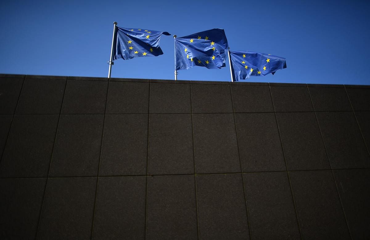 Flags of the European Union flutter ahead of the start of a European Union leaders' summit focused on migration, Brexit and eurozone reforms on in Brussels on Thursday. (AFP)