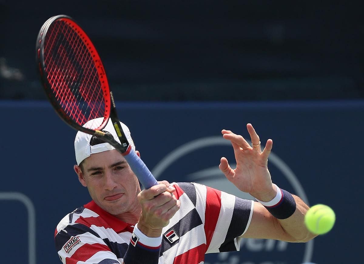 John Isner of the US returns during his win over Mischa Zverev of Germany at the Atlanta Open on Friday. AFP