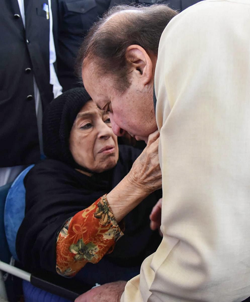 Pakistan's former prime minister Nawaz Sharif takes blessings from his mother before leaving for Aidiala Jail in Rawalpindi on September 17, 2018. PTI