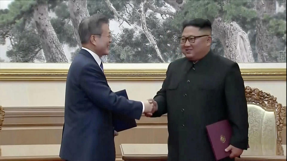 South Korean President Moon Jae-in and North Korean leader Kim Jong Un shake hands after signing documents during the inter-Korean summit at the Paekhwawon State Guesthouse in Pyongyang, North Korea in this still frame taken from video September 19, 2018.