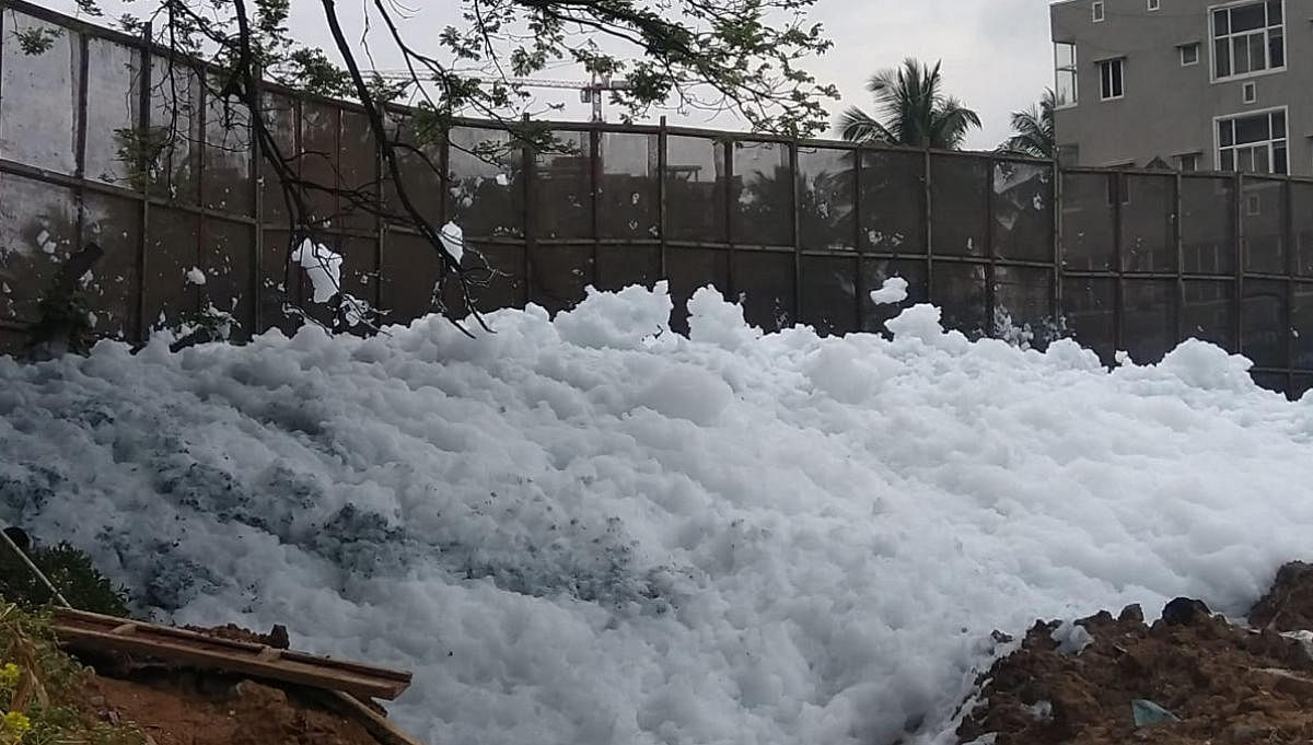 Accumulated foam at the Bellandur Lake weir on Wednesday. DH photo