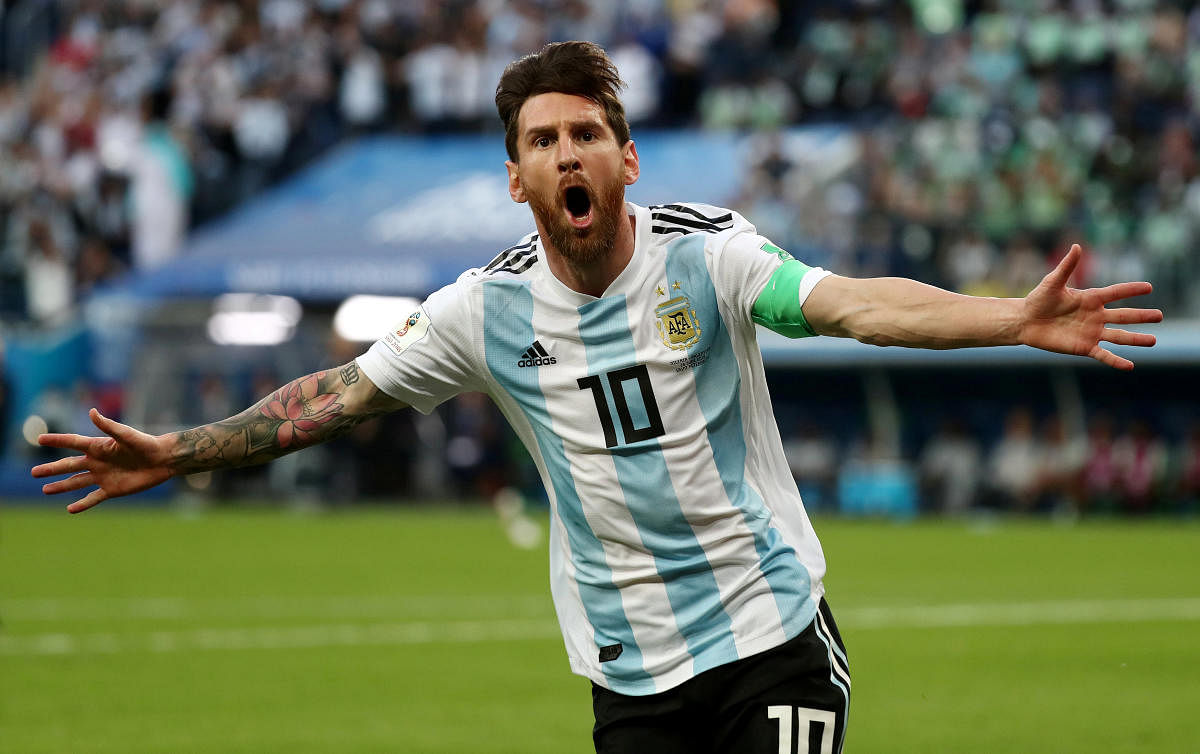 Argentina's Lionel Messi celebrates scoring their first goal. (REUTERS Photo)