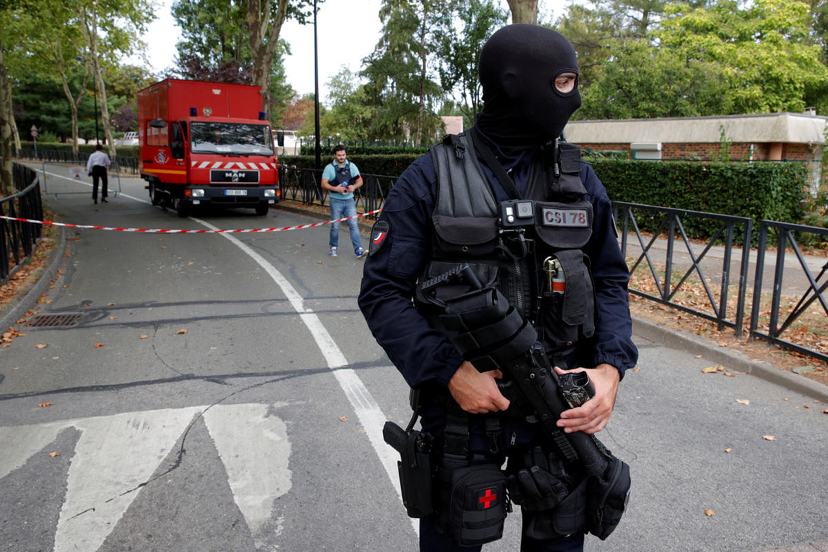 French police secure a street after a man killed two persons and injured an other in a knife attack in Trappes, near Paris, according to French authorities, France. Reuters photo