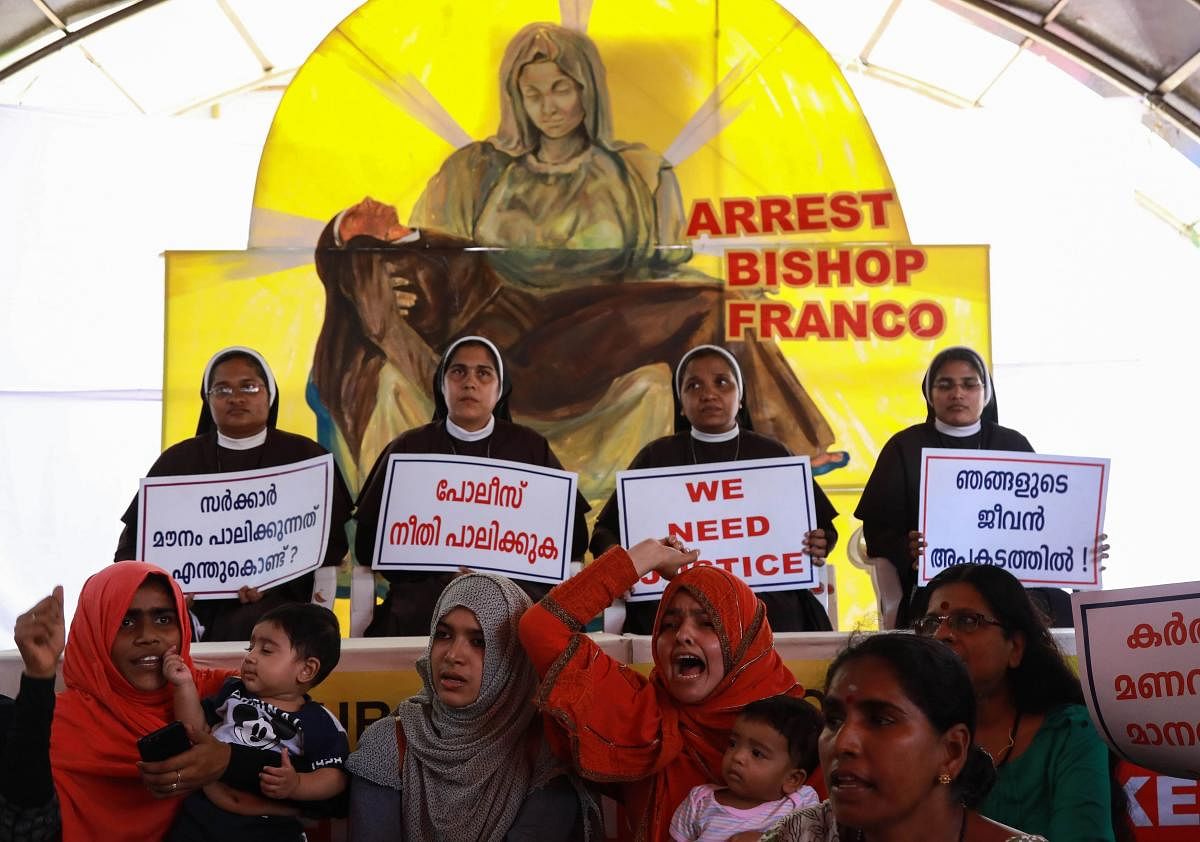 Indian Christian nuns and Muslim supporters demand the arrest of Bishop Franco Mulakkal, who is accused of raping a nun, outside the High Court in Kochi. AFP
