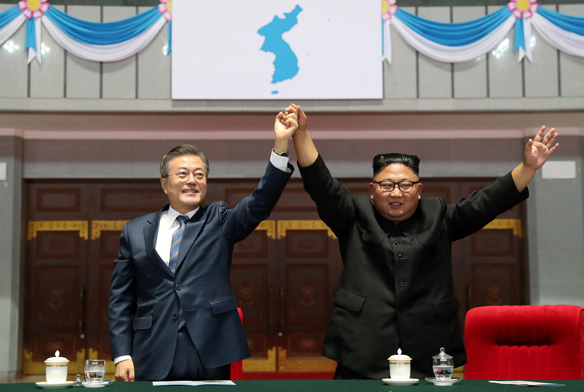 South Korean President Moon Jae-in and North Korean leader Kim Jong Un acknowledges the audience after watching the performance titled "The Glorious Country" at the May Day Stadium in Pyongyang, North Korea. Reuters Photo