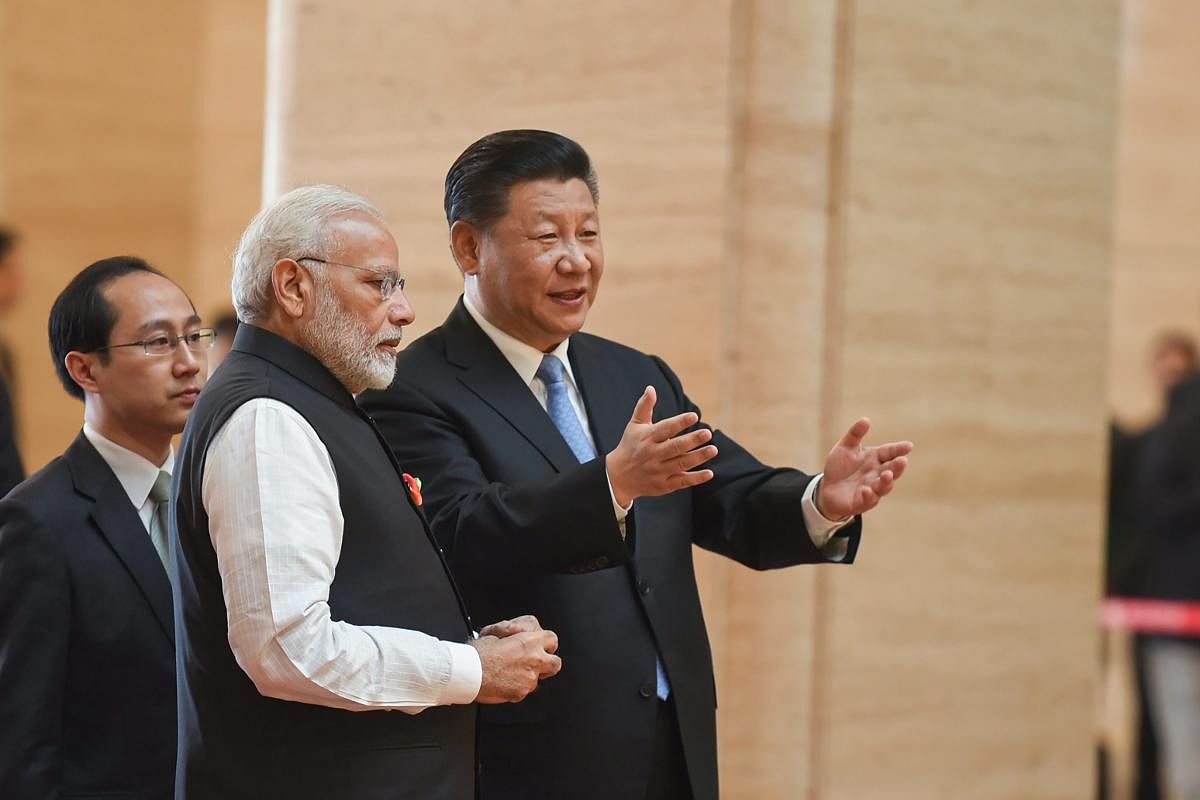 Prime Minister Narendra Modi with Chinese President Xi Jinping during his visit to Hubei Provincial Museum in Wuhan, China on Friday. PTI Photo