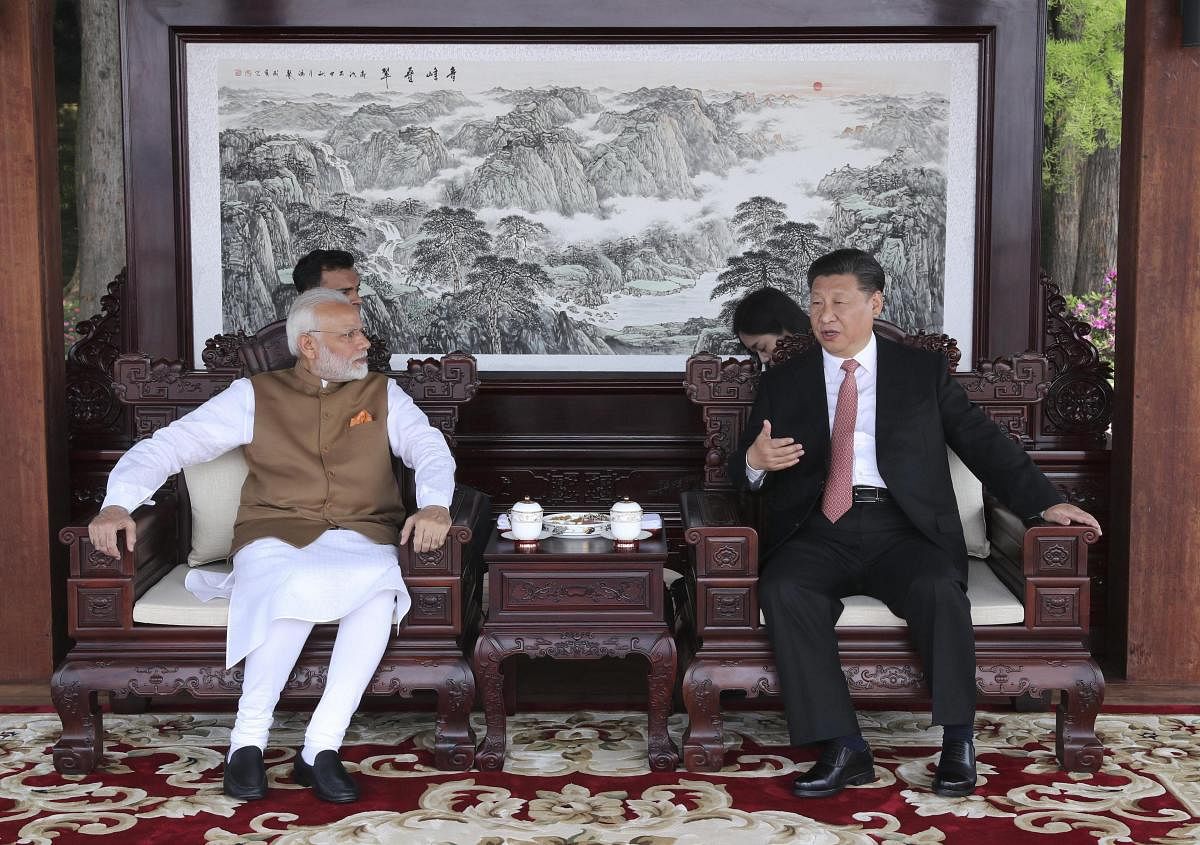 Indian Prime Minister Narendra Modi left, and Chinese President Xi Jinping talk during a meeting in Wuhan in central China's Hubei Province, Saturday, April 28, 2018. AP/PTI Photo
