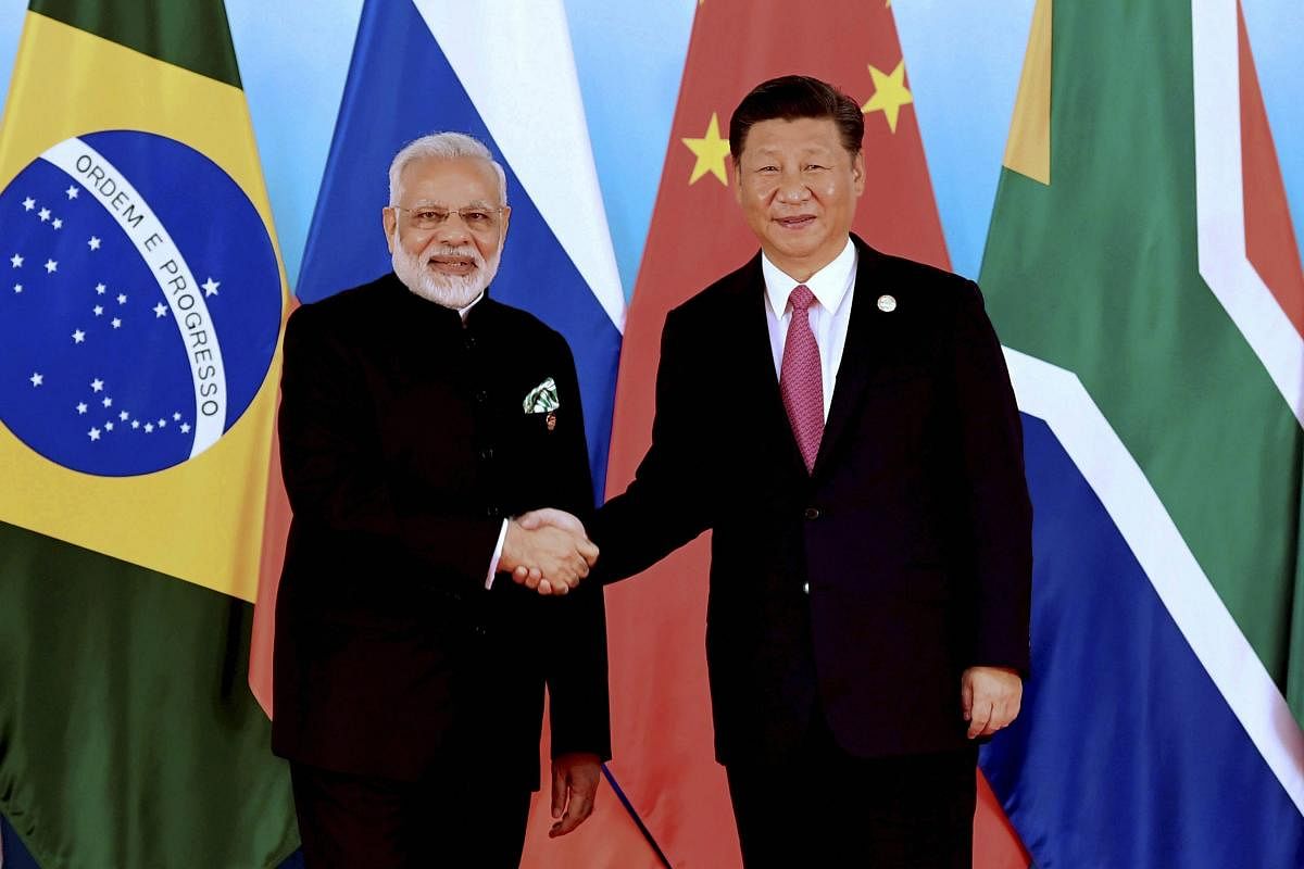 Chinese President Xi Jinping, right, shakes hands with Indian Prime Minister Narendra Modi at the BRICS Summit in Xiamen. AP/PTI file photo