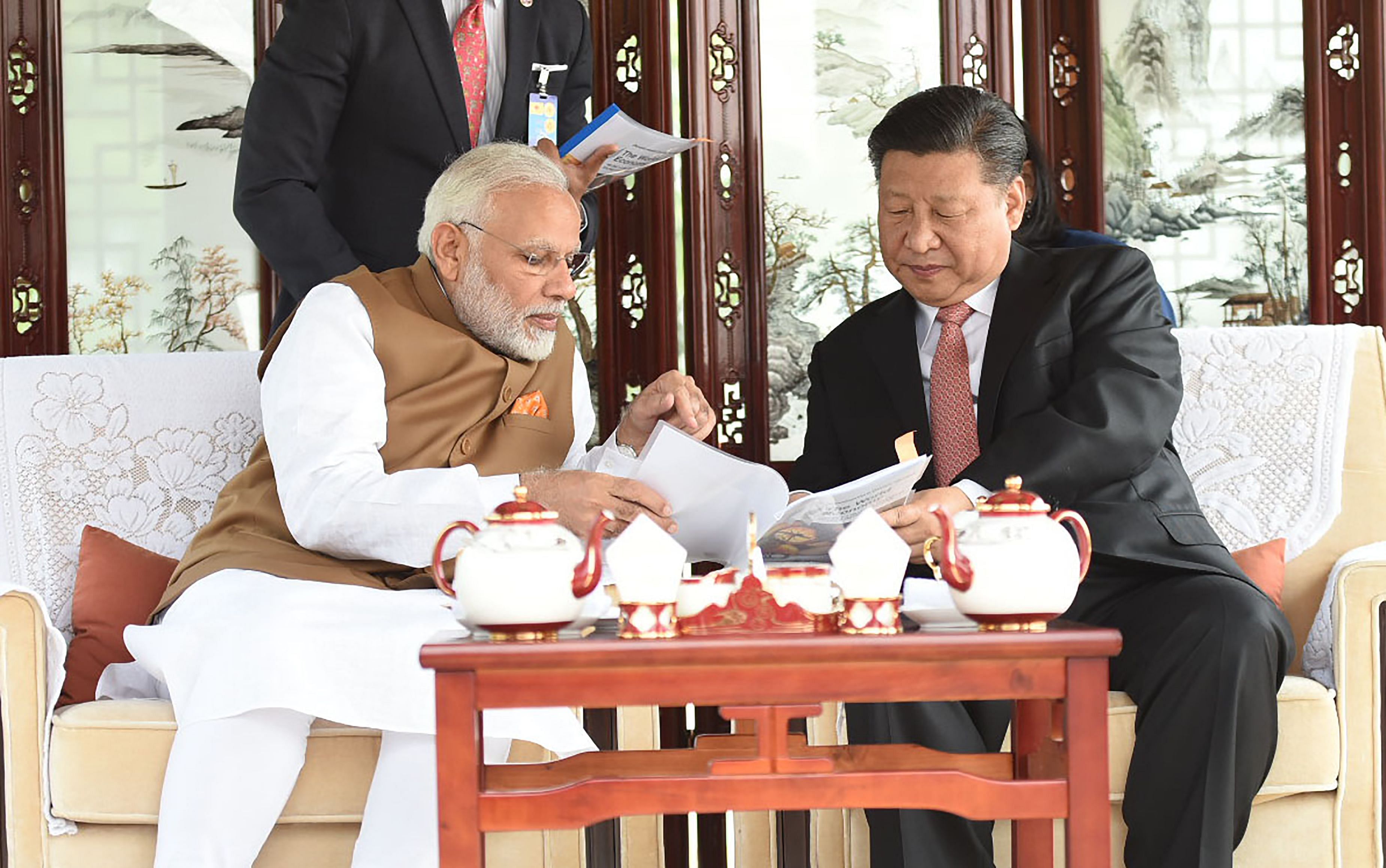 Prime Minister Narendra Modi and Chinese President Xi Jinping hold talks at the East Lake in Wuhan, China, on Saturday. Reuters