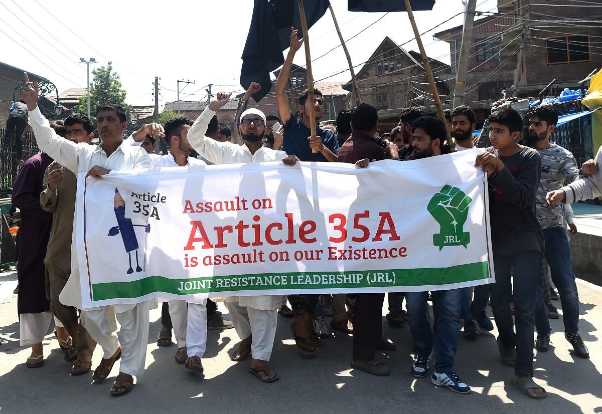 Kashmiri muslims shout anti-Indian slogans during a demonstration against attempts by the NGO 'We the Citizens' and individual citizens to revoke article 35A and 370, in downtown Srinagar. AFP.