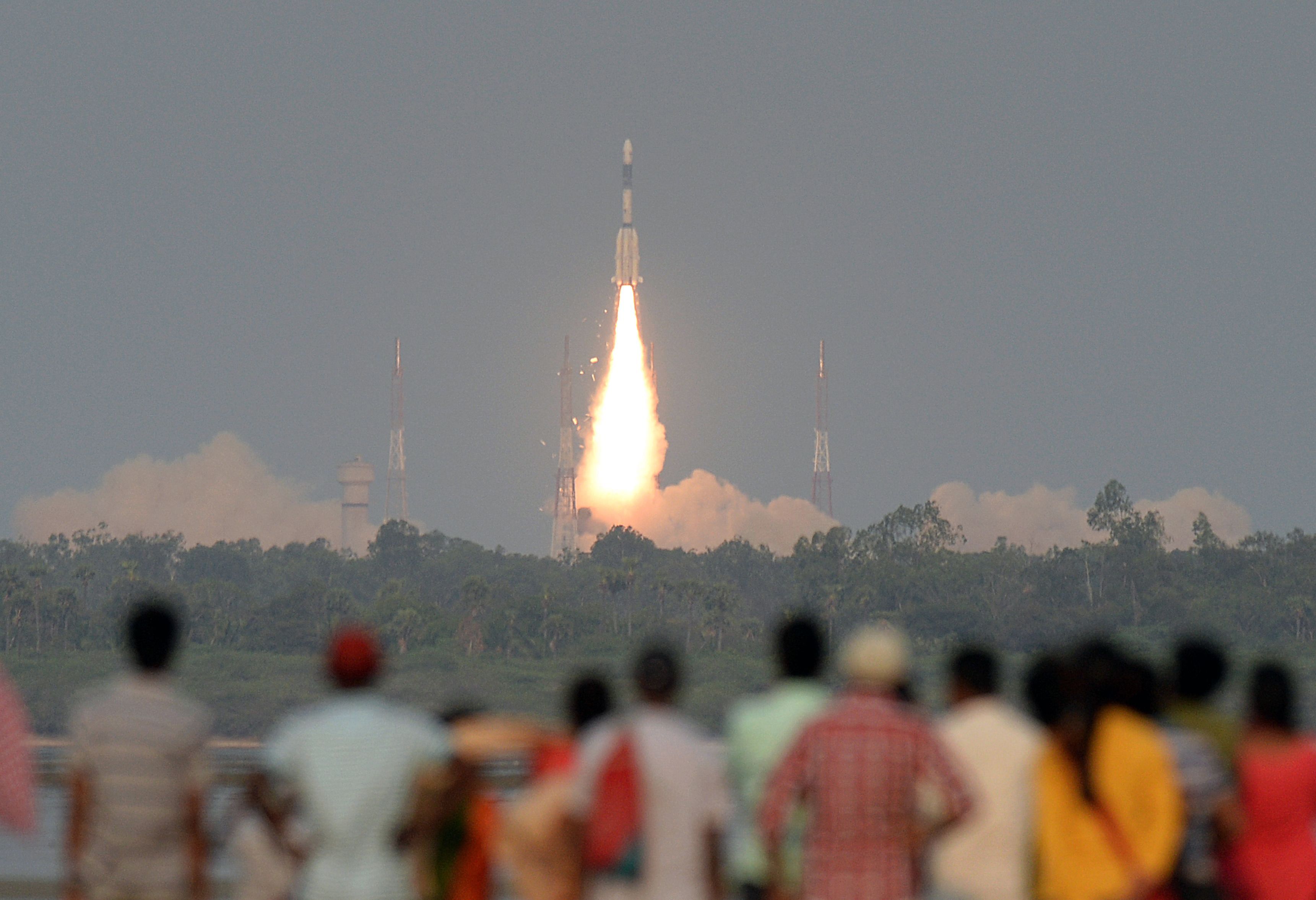 People watch as a GSAT-6A satellite takes off on the Geosynchronous Satellite Launch Vehicle from Sriharikota. (AFP file pic)