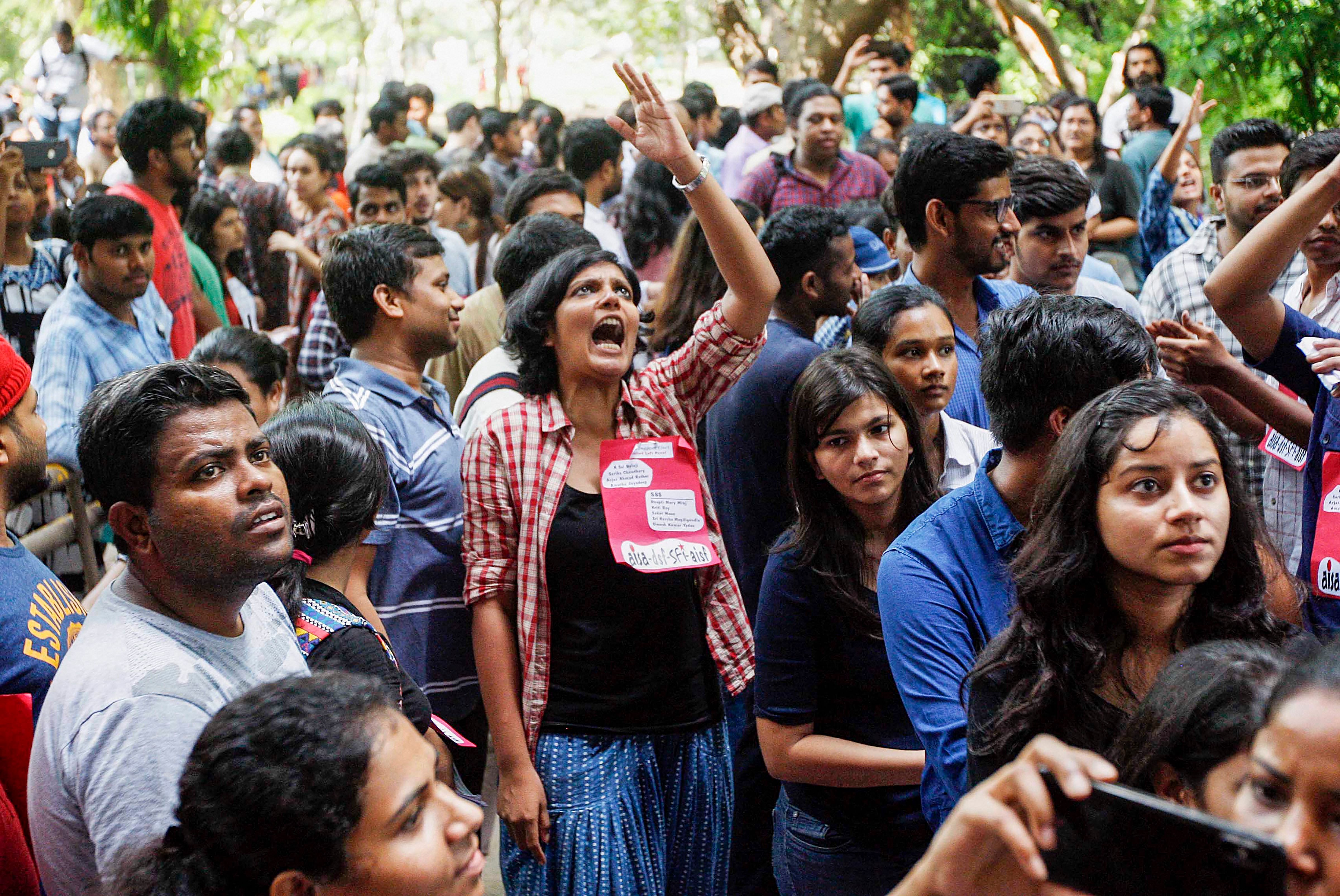 Jawaharlal Nehru University students wait to place their votes during the students' union polls, in New Delhi, Friday. PTI