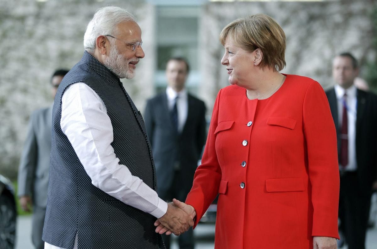 Berlin : German Chancellor Angela Merkel, right, welcomes the India's Prime Minister Narendra Modi, left, for a meeting at the chancellery in Berlin, Germany, Friday, April 20, 2018. AP/ PTI(AP4_20_2018_000196B)