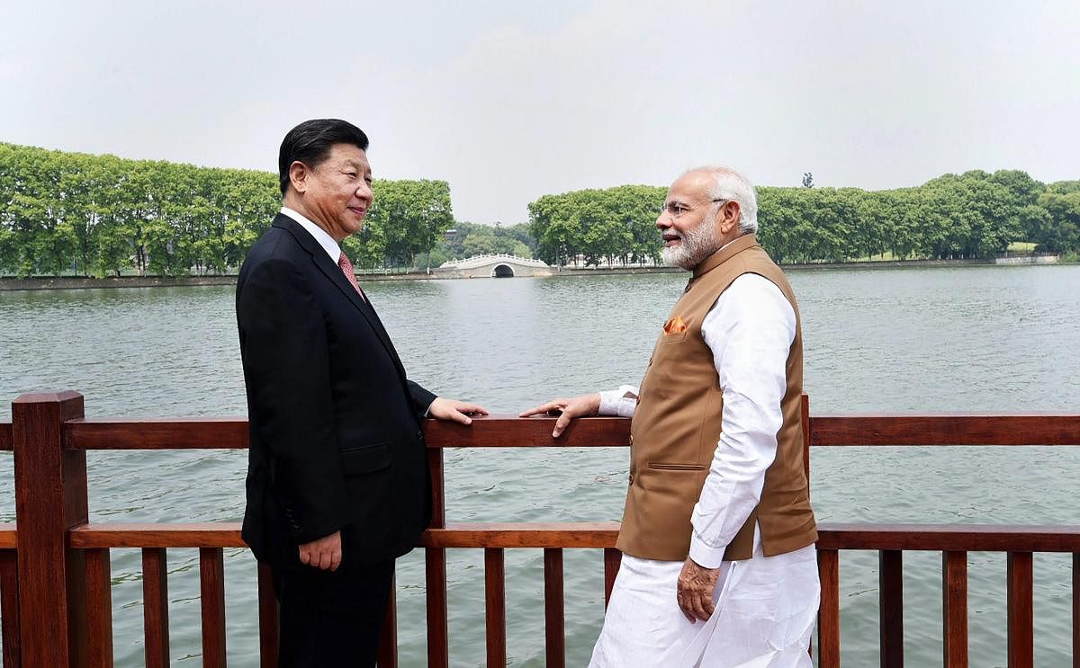 Prime Minister Narendra Modi with Chinese President Xi Jinping along the East Lake, in Wuhan, China. (PTI File Photo)