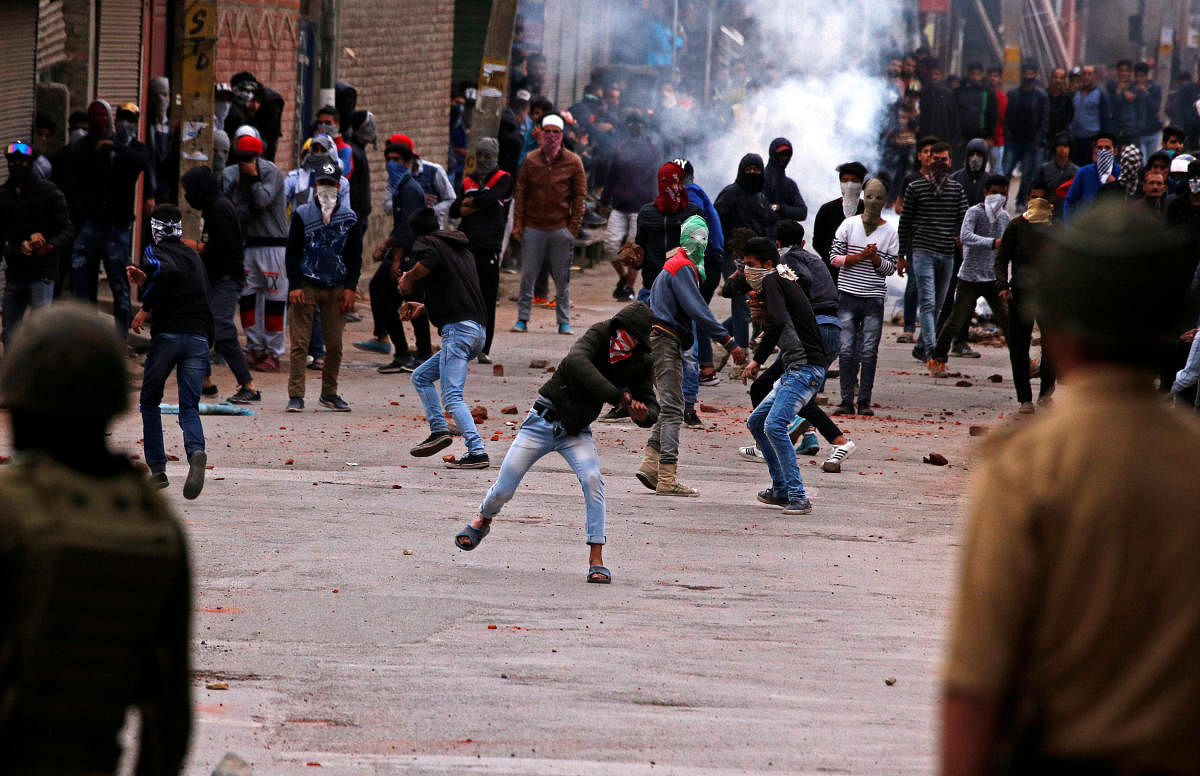 Youths throw stones at the police during a protest in Srinagar. (Reuters file pic)