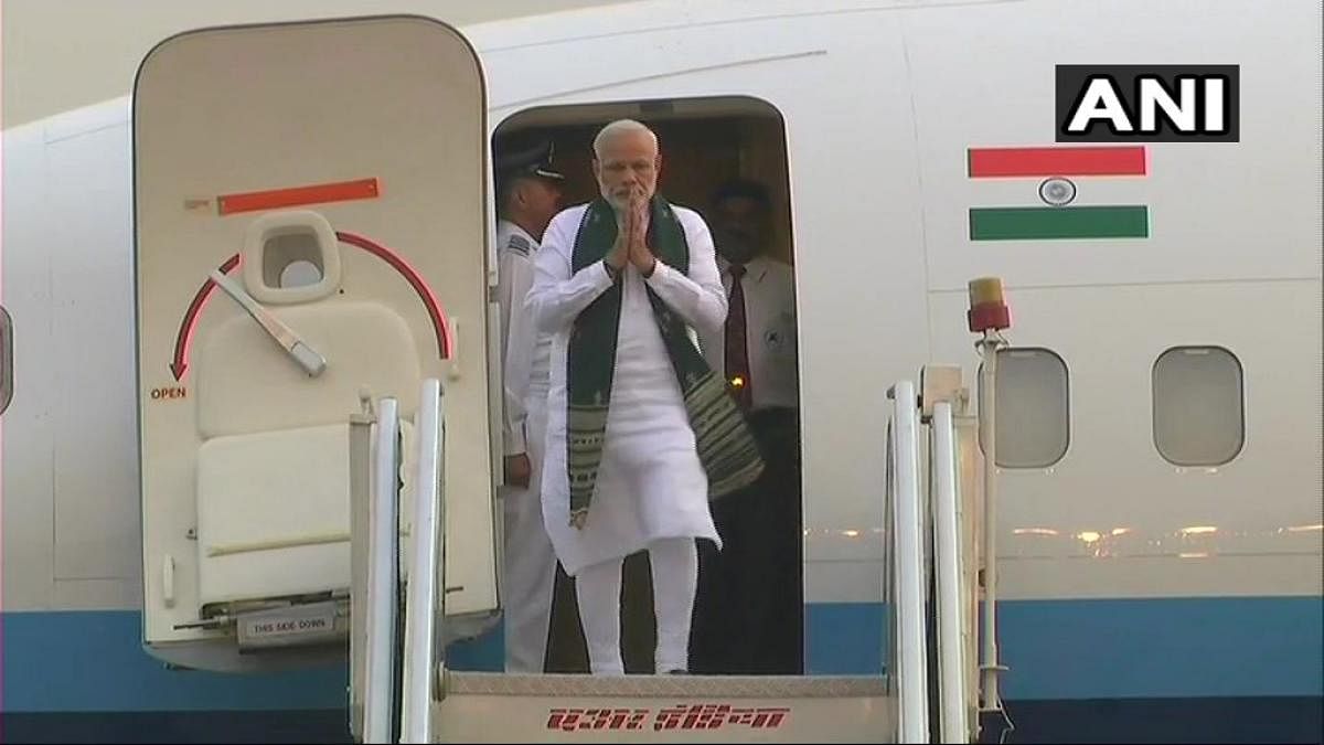 Prime Minister Narendra Modi coming out of the aeroplane after his Nepal visit. (ANI)