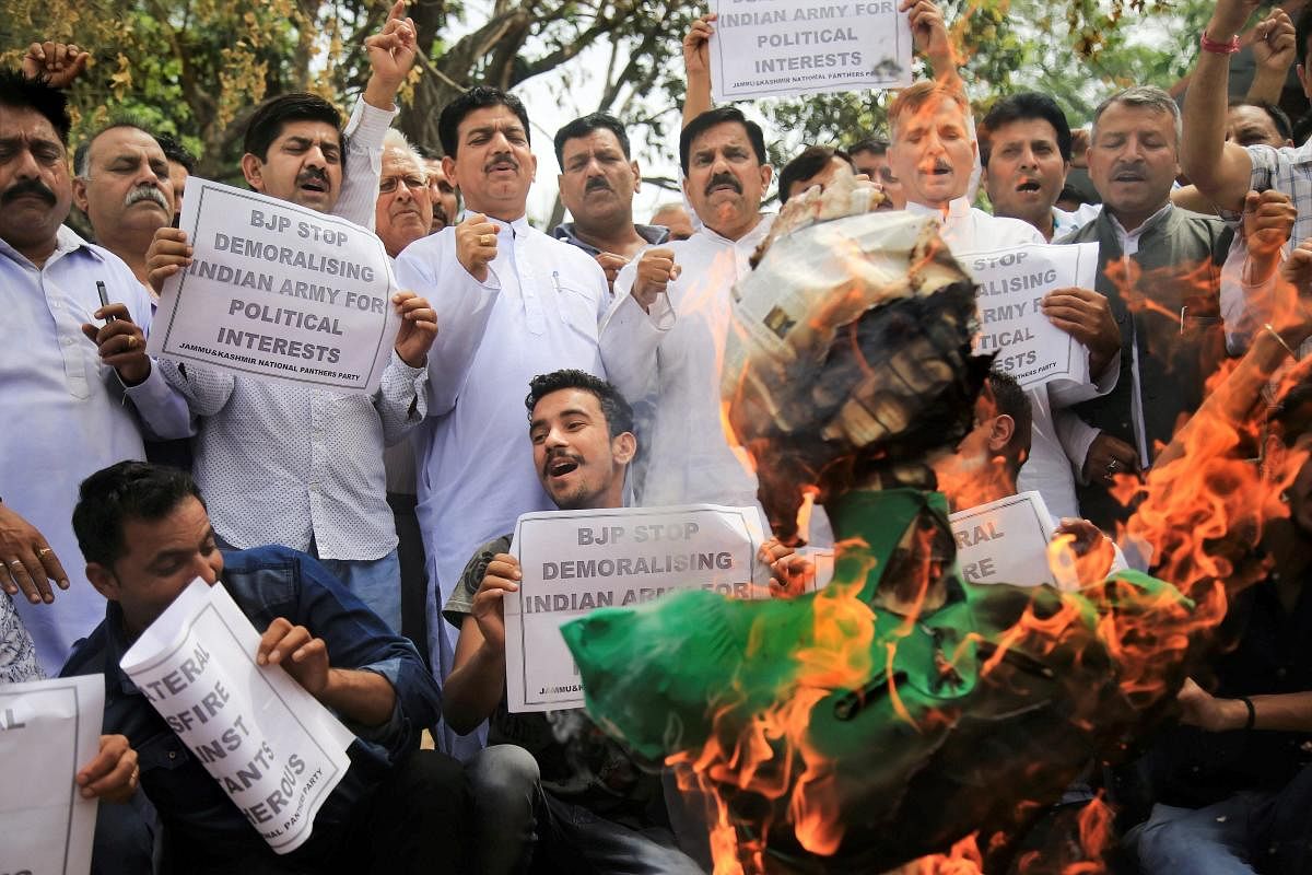 Jammu and Kashmir Nation Panthers Party (JKNPP) activists burn the effigy of Chief Minister Mehbooba Mufti over her appeal for 'unilateral ceasefire', in Jammu on Thursday. PTI Photo
