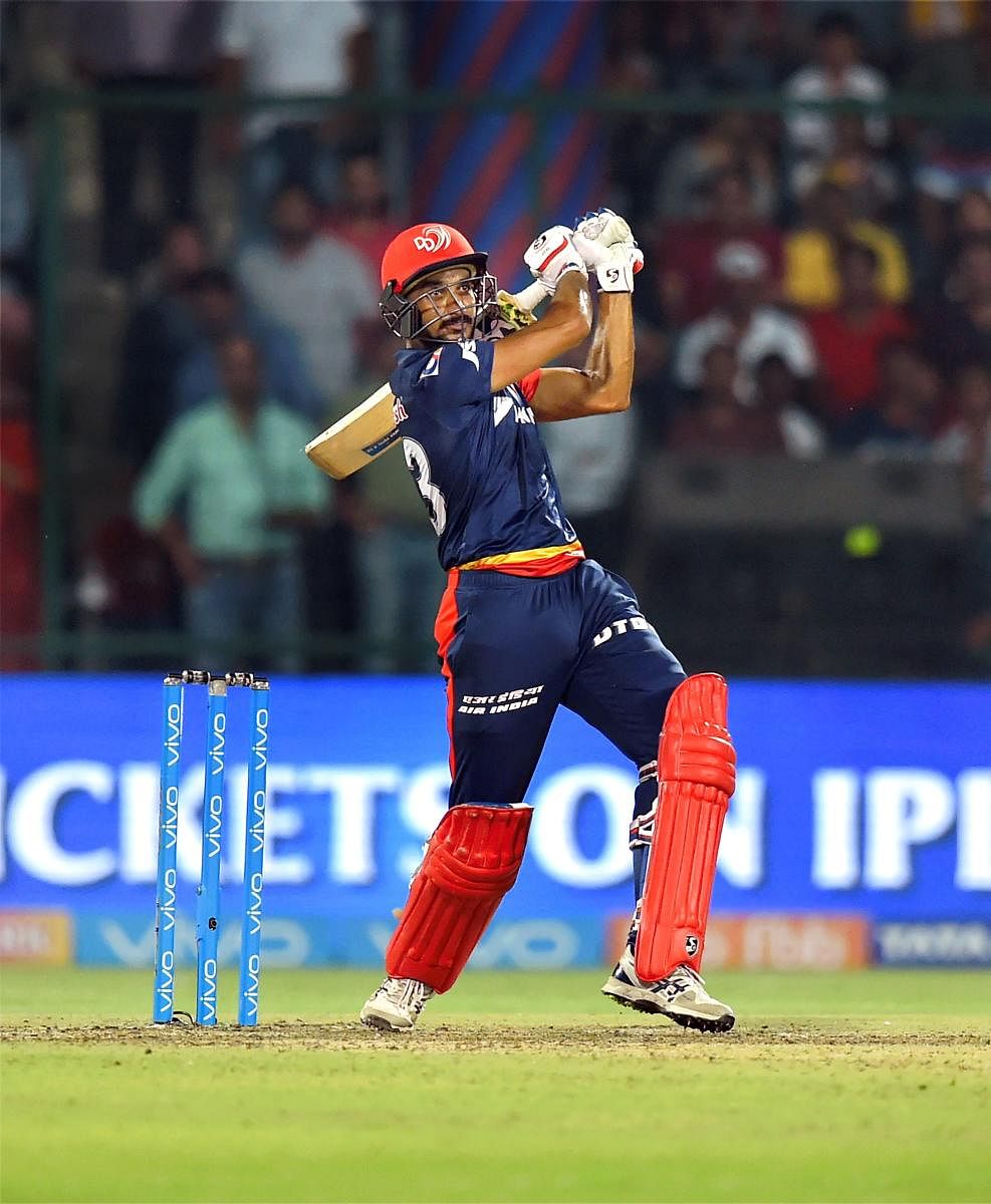 Delhi Daredevils' Harshal Patel hammers one to the boundary during his unbeaten 16-ball 36 on Friday. PTI 