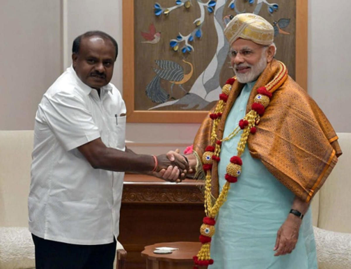 Chief Minister H D Kumaraswamy meets Prime Minister Narendra Modi, during his visit to Delhi, on Monday.