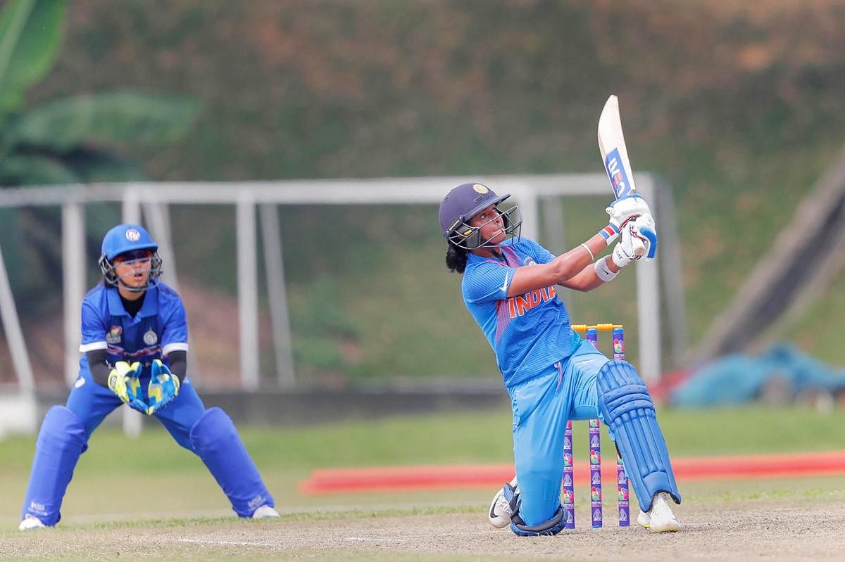 Indian cricketer Harman Kaur hits a boundary against Thailand during Asia Cup 2018, in Kuala Lumpur, Malaysia on Monday, June 04, 2018. (PTI Photo)