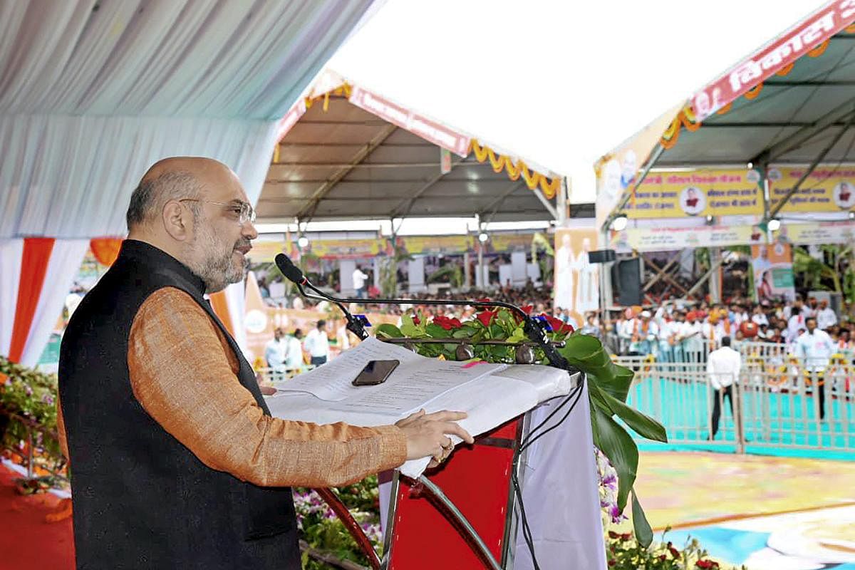BJP president Amit Shah addresses his supporters during a public meeting in Ambikapur on Sunday. PTI