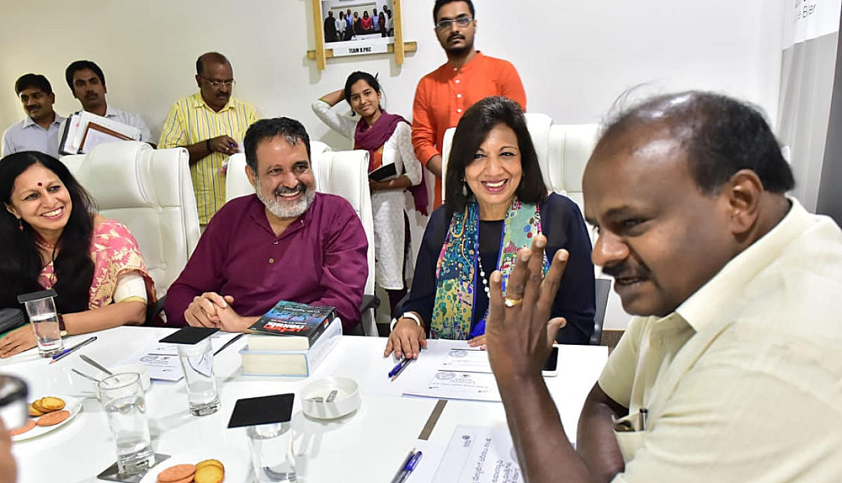 Chief Minister H D Kumaraswamy (right) with B.PAC members Kiran Mazumdar-Shaw and T V Mohandas Pai in Bengaluru in Saturday. DH photo