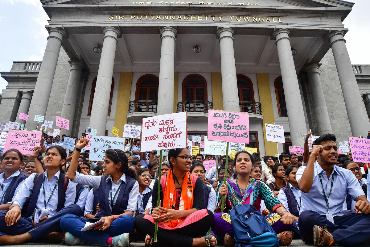 Students hold a protest at Town Hall on Tuesday against the government’s decision to allow private agricultural colleges.