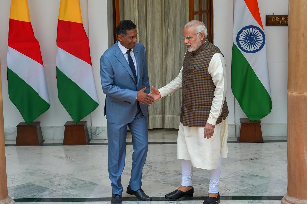 Prime Minister Narendra Modi shakes hands with Seychelles President Danny Antoine Rollen Faure ahead of a meeting at Hyderabad House, in New Delhi on Monday. (PTI Photo)