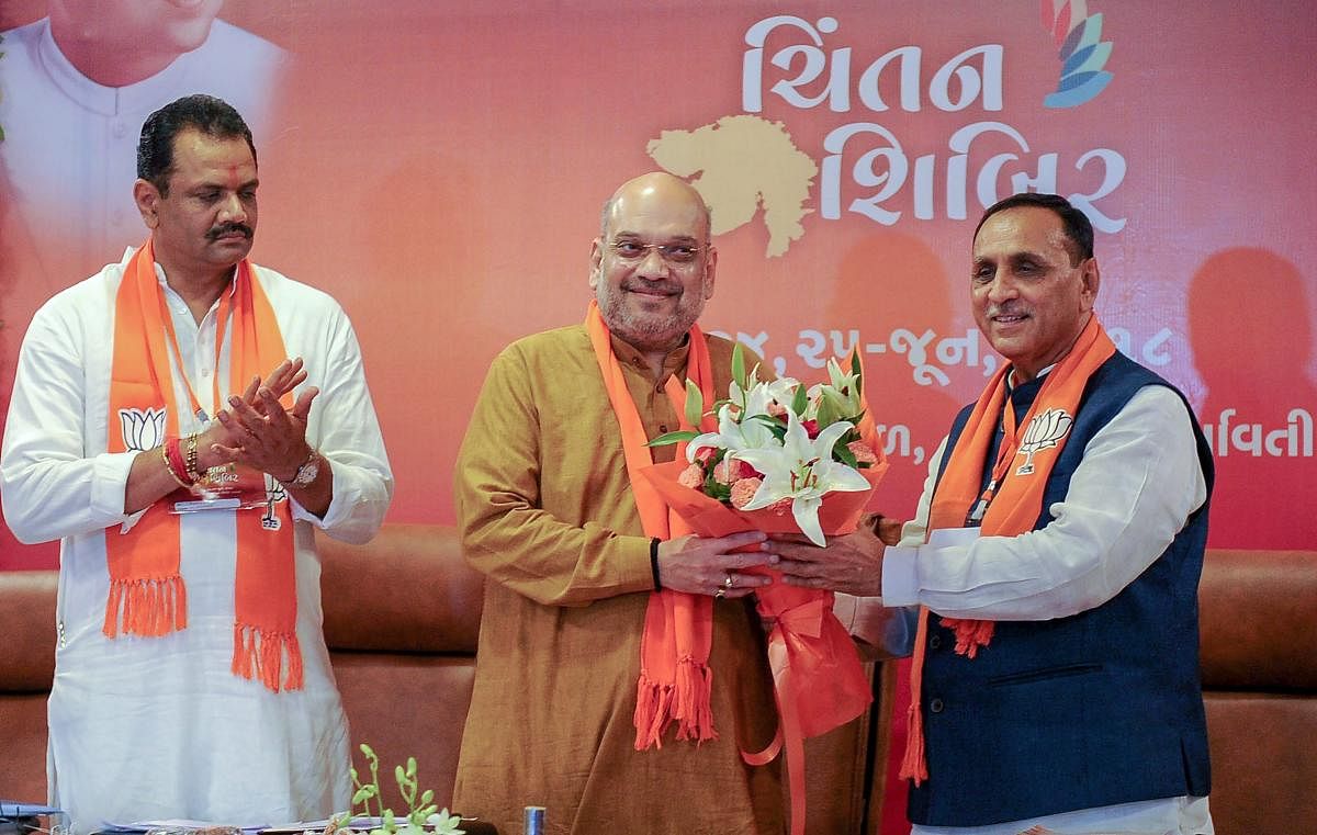 BJP president Amit Shah being greeted by Gujarat Chief Minister Vijay Rupani during the second day of the party's two-day 'Chintan Shivir', in Ahmedabad on Monday. PTI