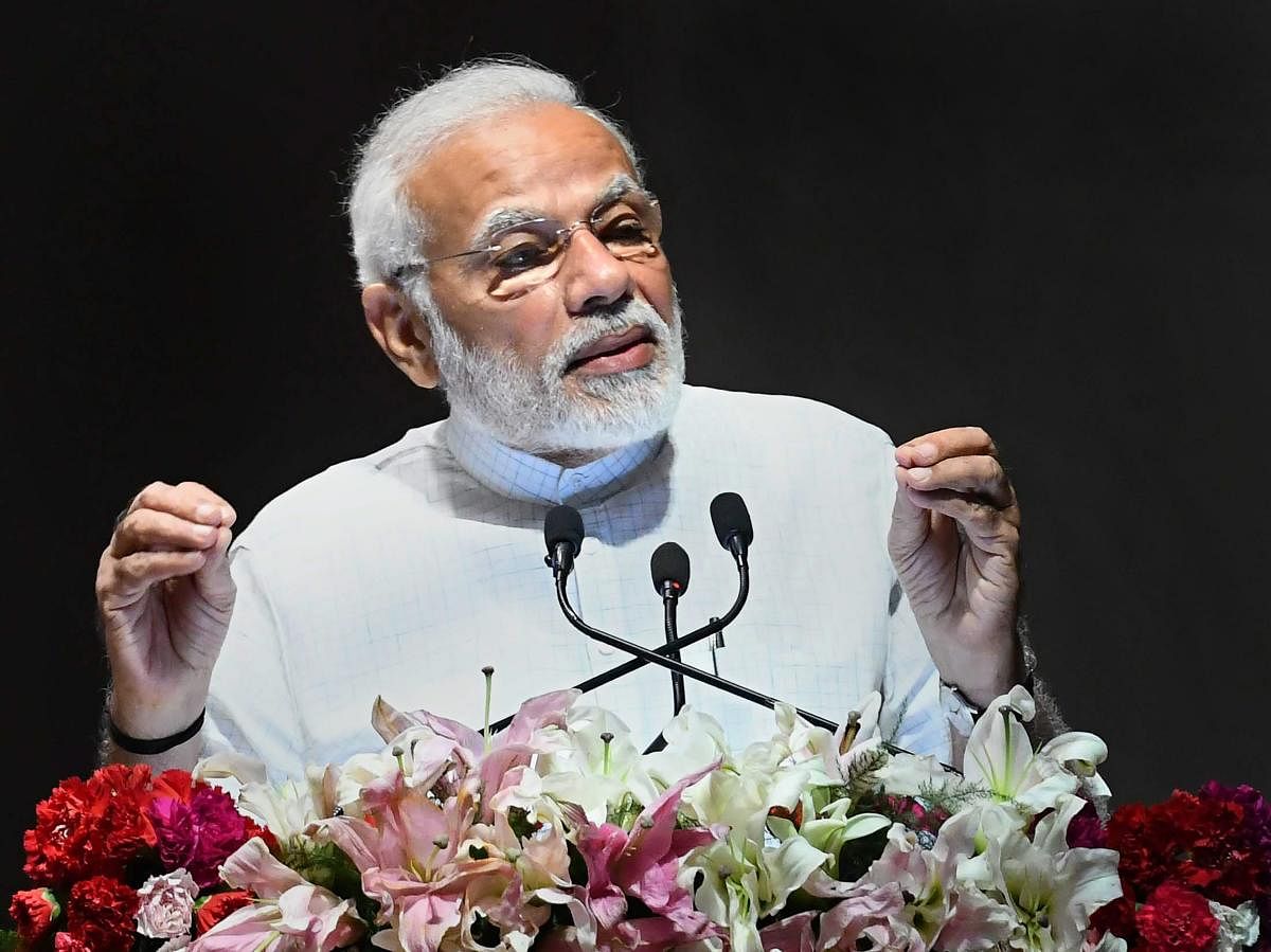 Prime Minister Narendra Modi addresses the gathering after the launch of various healthcare projects, at AIIMS, in New Delhi on Friday. PTI