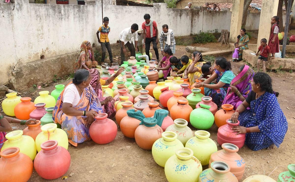 Fetching water is still a Herculean task for people in several villages. The universal drinking water scheme will require creation of infrastructure to connect water sources to the villages. dh file photo
