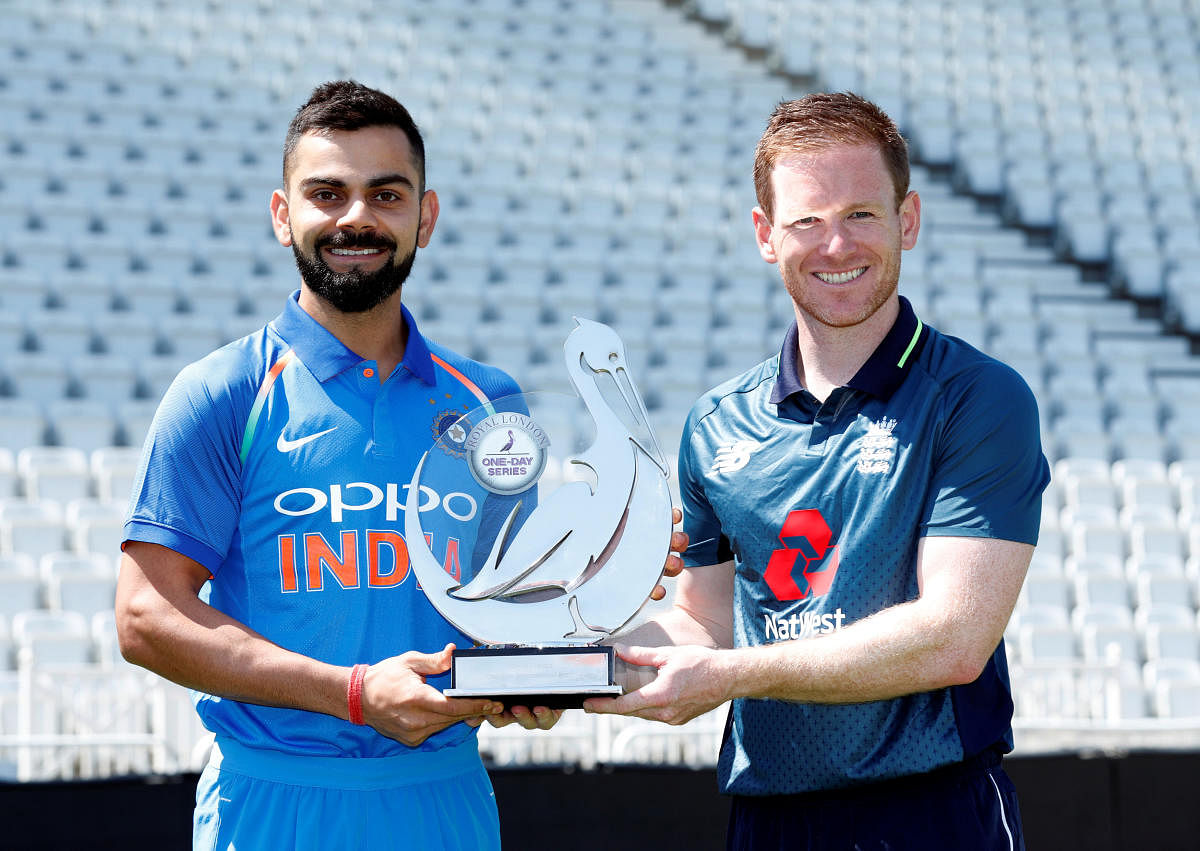 Virat Kohli and Eoin Morgan pose with the trophy. (Reuters Photo)