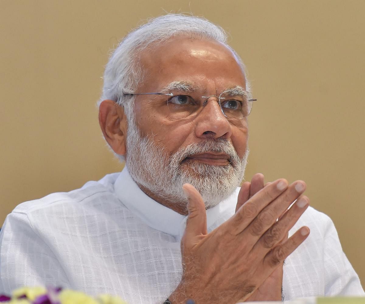 The Congress asked Modi to make public the "reasons and pressures" behind his "unprecedented intervention" to ease norms pertaining to land, finances and academic expertise of the institutes seeking the 'IoE' tag. PTI File Photo