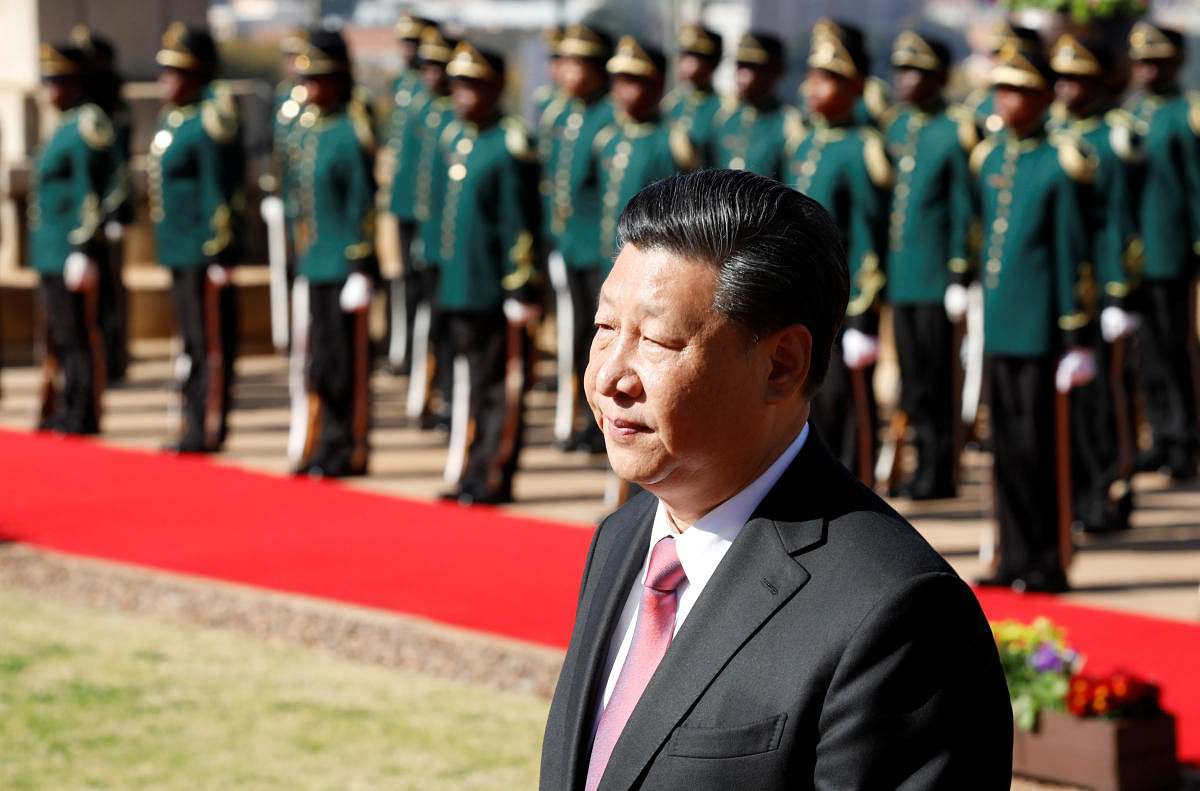 China's President Xi Jinping inspects a guard of honour as he arrives for a meeting with South African President Cyril Ramaphosa at the Union Buildings in Pretoria, South Africa, July 24, 2018. REUTERS/Mike Hutchings