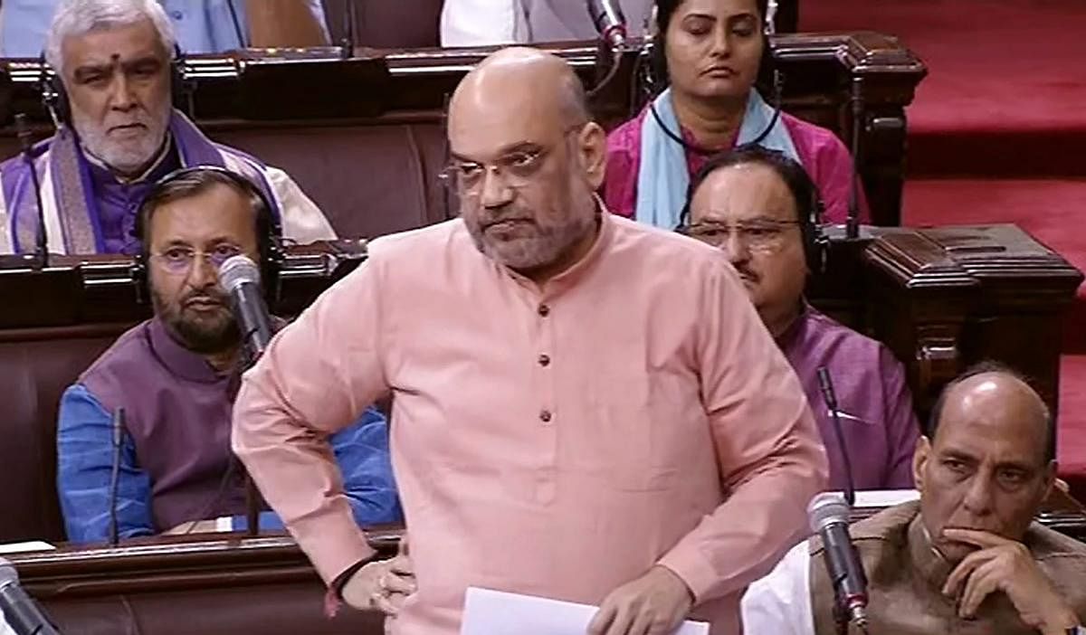 BJP President Amit Shah reacts in the Rajya Sabha during the Monsoon session of Parliament, in New Delhi on Tuesday, July 31, 2018. (RSTV GRAB via PTI)