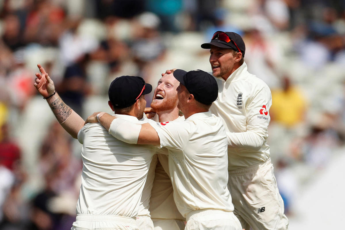 THAT'S IT: England's Ben Stokes (centre) celebrates with team-mates after dismissing Hardik Pandya, the last Indian batsman to fall in the opening Test on Saturday. Reuters