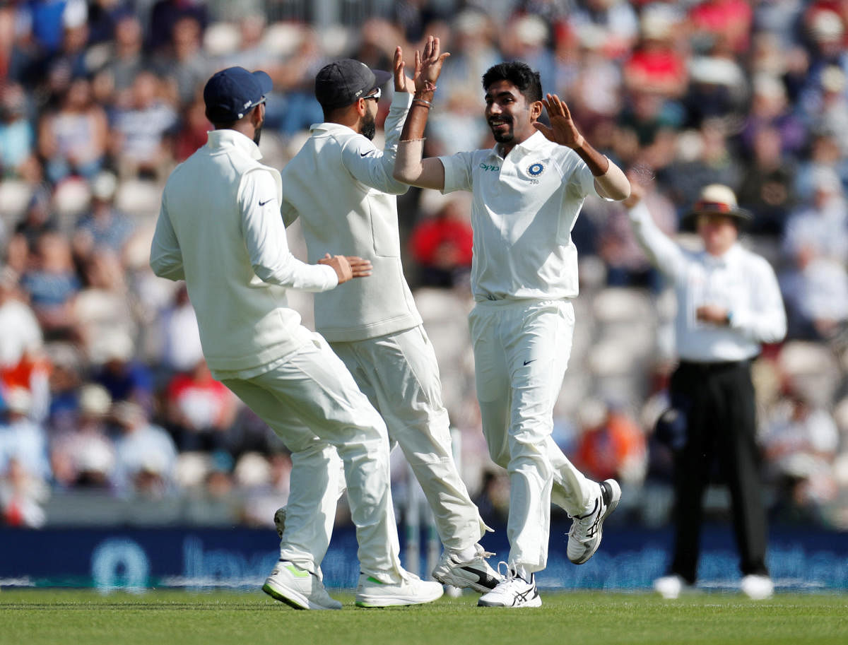 ON FIRE: India’s Jasprit Bumrah (right) celebrates with team-mates after dismissing England opener Keaton Jennings on the opening day of the fourth Test at Southampton on Thursday. AFP
