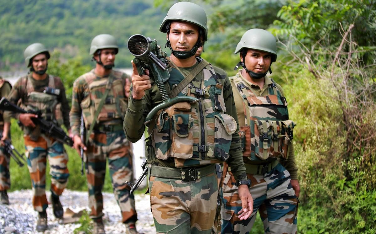 Army personnel carry out a search operation after militants attacked a CRPF party at Jahjar Kotli on Srinagar-Jammu National highway, 35 kms away from Jammu, on Wednesday. (PTI Photo)