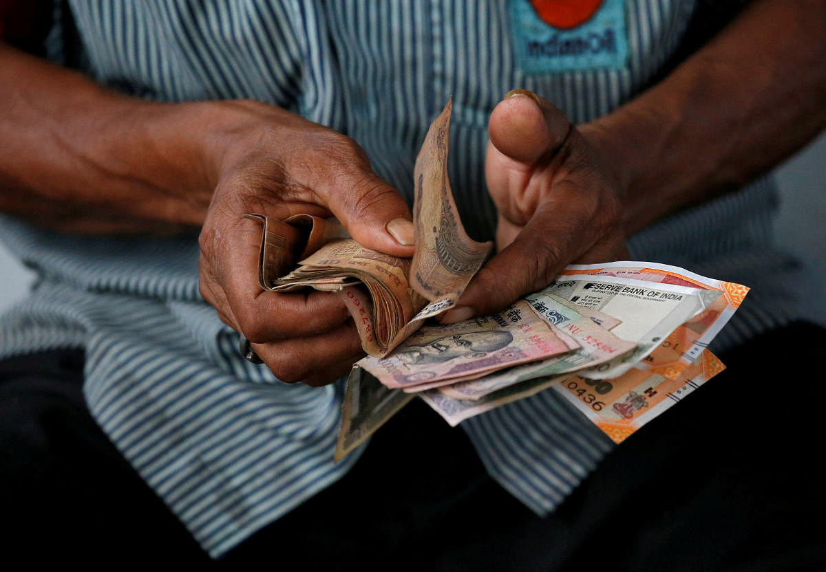 Rupee firmed by another 53 paise to trade at over a two-week high of 71.84 against the US dollar in early trade on Friday. Reuters File Photo