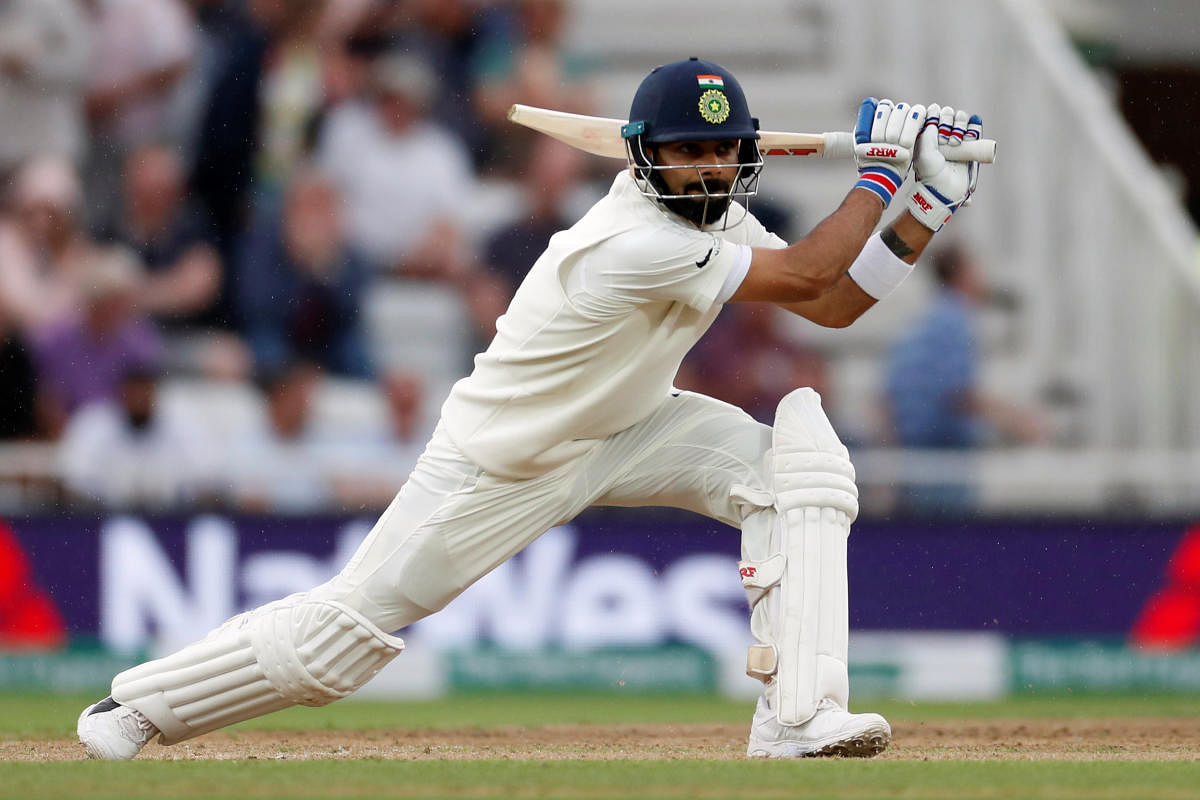STYLISH: Indian skipper Virat Kohli drives one to the fence on the third day of the third Test against England in Nottingham on Monday. Reuters