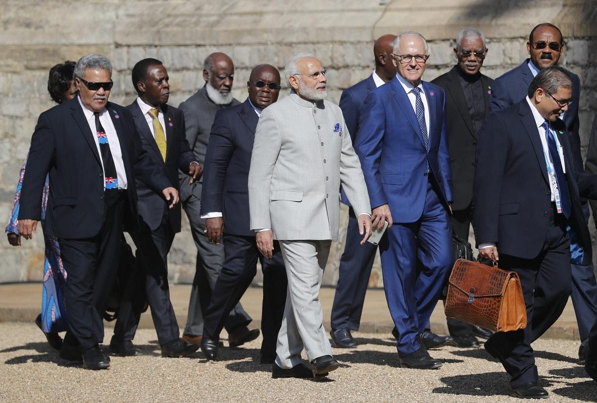 Australian Prime Minister Malcolm Turnbull, centre right, talks to the Indian Prime Minister Narendra Modi, centre left, as they arrive for the the second day of the Commonwealth Heads of Government 2018 for a behind closed doors meeting in Windsor, England, Friday, April 20, 2018. Leaders from the 53-nation Commonwealth nations are meeting in Windsor Castle Friday, without official agenda but are widely expected to discuss protecting the world's oceans, cybersecurity and who should become the next leader of the Commonwealth. AP/PTI