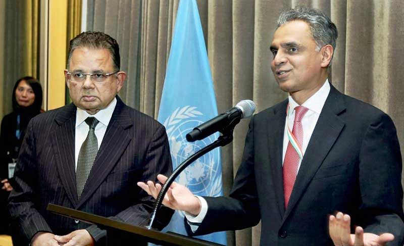  India's Permanent Representative to the United Nations Syed Akbaruddin speaks during a reception in the honour of Justice Dalveer Bhandari (L) at the United Nations in New York on Monday. India's Dalveer Bhandari won the votes in the UN General Assembly to make it to the International Court of Justice after UK pulled out the race. PTI Photo