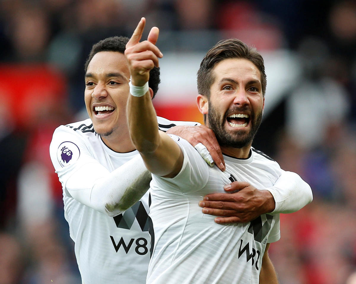 Wolverhampton Wanderers' Joao Moutinho (front) celebrates with Helder Costa after scoring against Manchester United on Saturday. REUTERS