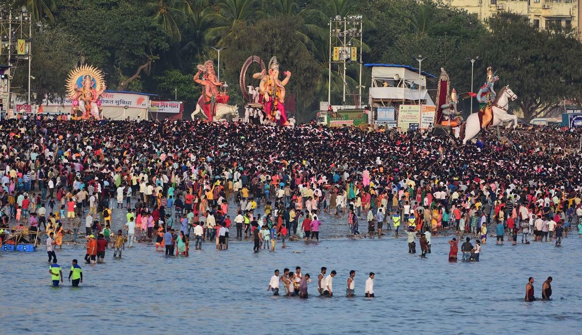 People crowd during the Ganesha immersion at Girgaum chowpatty in Mumbai. DH Photo